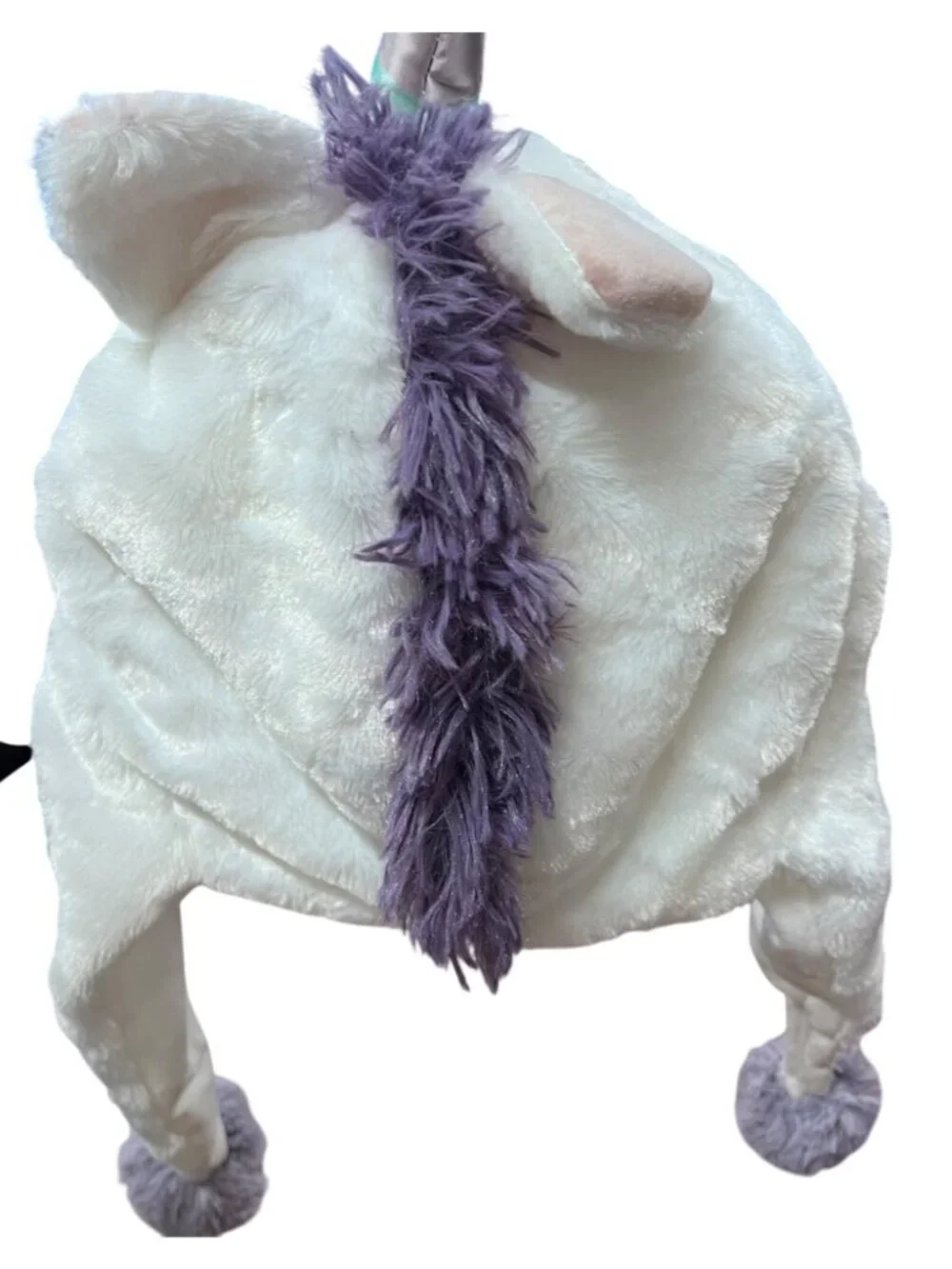 Plush Unicorn Hat with pom-pom ear flaps, whimsical, fun, playful